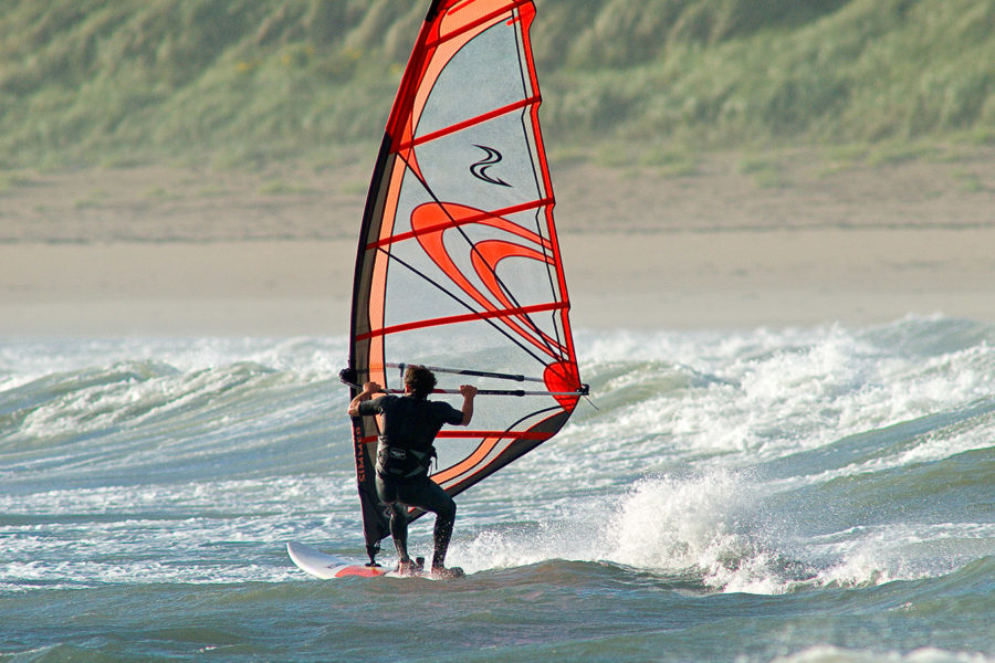 Windsurfing is one of the many outdoor activities that Eryri (Snowdonia) has to offer.