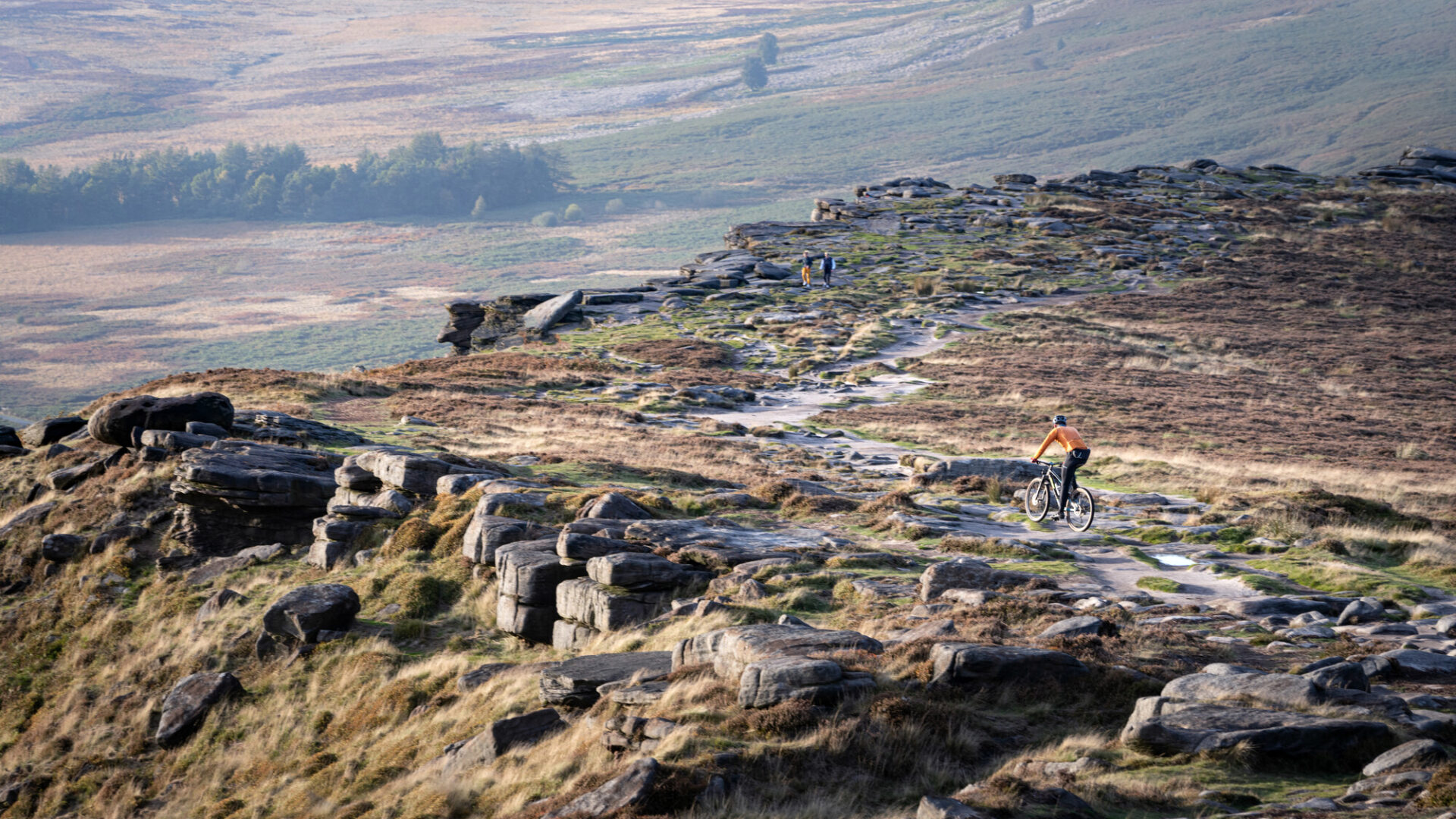 Cyclist and walkers on Stanage Edge